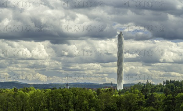 The TK-Elevator test tower in Rottweil next to a church tower. The 246 metre high lift test tower