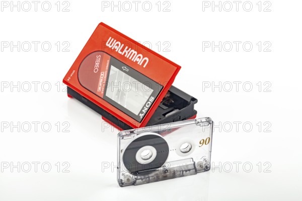 WETZLAR, Germany: 2022-04-16: Beautiful red vintage SONY WALKMAN WM-24 with audio tape over bright