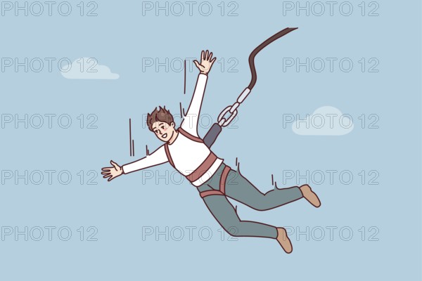 Excited young man jumping with parachute. Smiling guy enjoy extreme sport with rope jumping.
