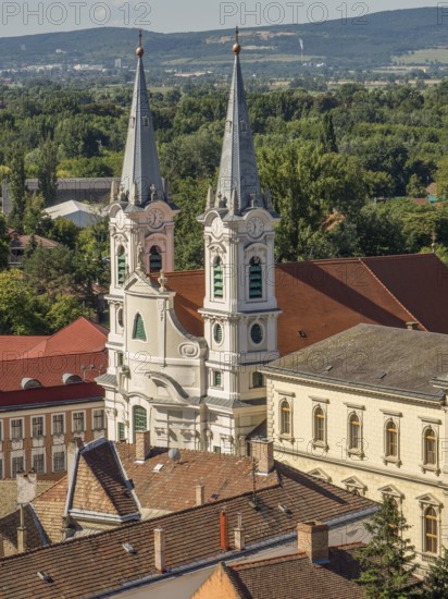 View of church towers and surrounding houses with tiled roofs in a picturesque village, esztergom,