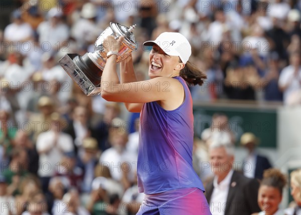 French Open 2024 Champion Iga Swiatek of Poland is holding the trophy at Roland Garros, Paris,