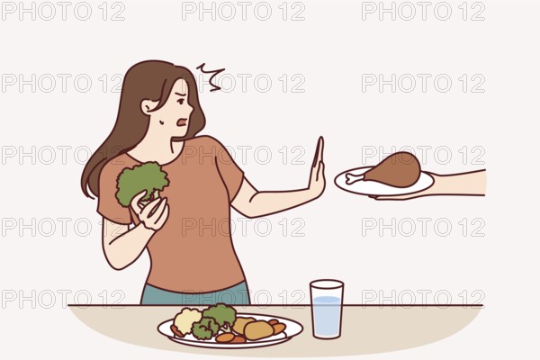 Vegetarian woman refuses meat and makes stop gesture in fear while eating fresh vegetables.