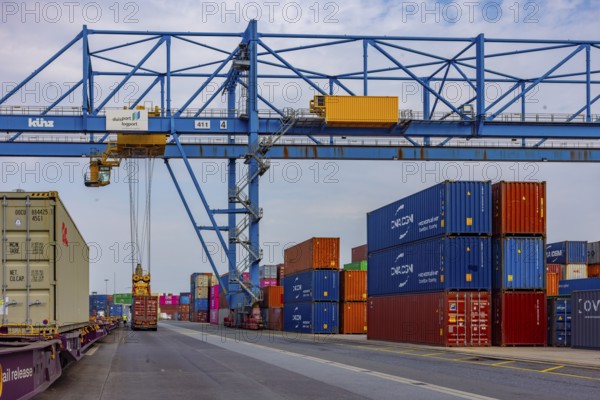 Crane loads containers onto trains and lorries at the D3T container port, Logport l, Rhine,