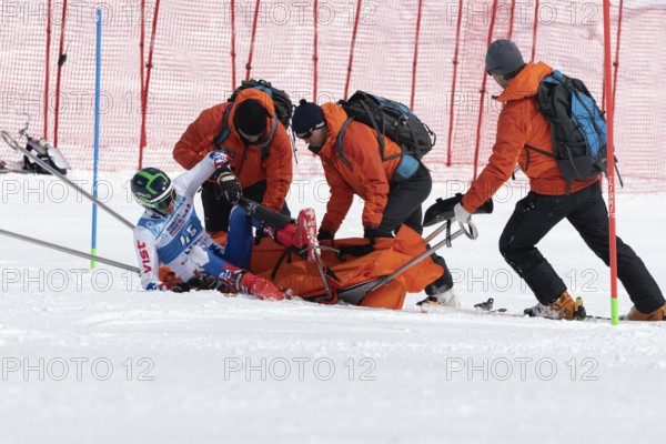 KAMCHATKA PENINSULA, RUSSIA, MAR 28, 2019: Rescuers Kamchatka Rescue Squad on alpine ski evacuate