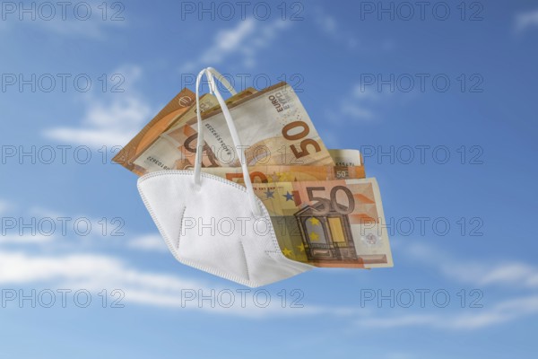 Medical ffp2 face mask against covid-19 filled like a bag with euro banknotes, concept for