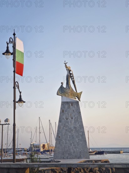 The statue of Saint Nicholas patron of sailors in the old town of Nessebar, Bulgaria. Serene sunset