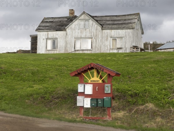 Derelict house on the shore of the Arctic Ocean, beside the town of Nesseby, May, Varangerfjord,