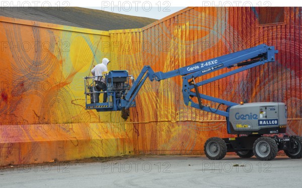 American street artist Douglas Hoekzema, also known as HOXXOH paints a wall in Ystad, Skåne County,