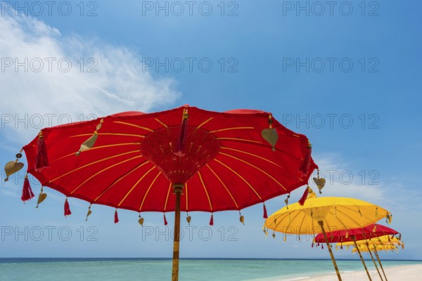 Traditional Balinese temple sunshade as parasol, Hinduism, symbol, beach holiday, protection, sun