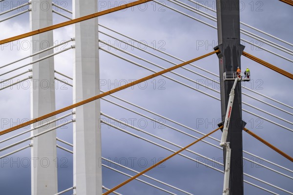The new Rhine bridge Neuenkamp, the A40, white pillar ropes, and the old motorway bridge, which is