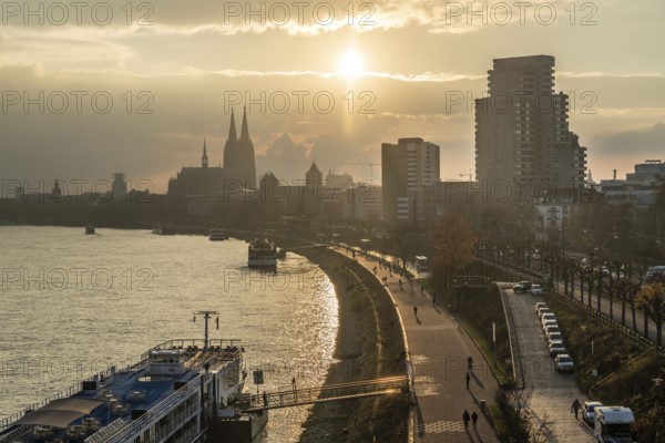 The Rhine near Cologne, sunset, Cologne Cathedral, cargo ship, North Rhine-Westphalia, Germany,