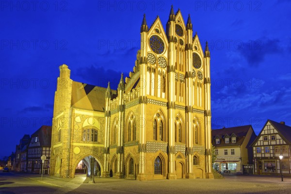 Tangermünde town hall on the market square, surrounded by half-timbered houses, illuminated in the