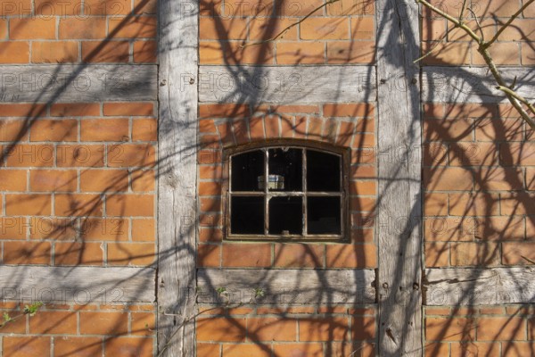 An old rusty window frame of a half-timbered barn, Wildeshauser Geest, Bassum, Diepholz, Lower