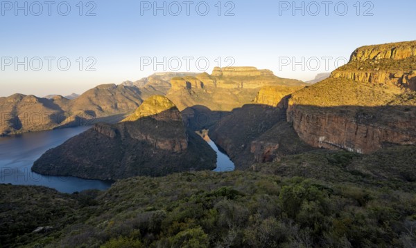 Sunset at Blyde River Canyon with Three Rondawels peak, view of canyon with Blyde River and Mesa