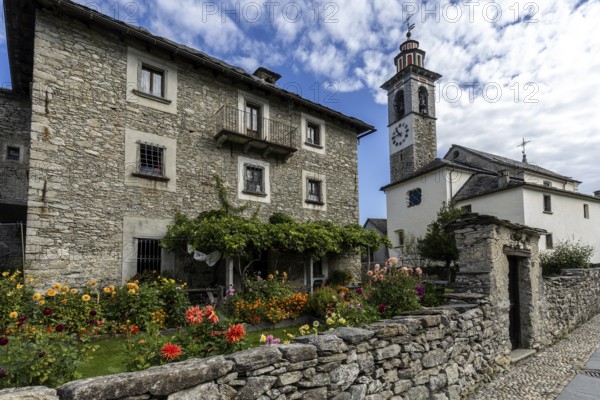 View of the village, typical Ticino stone houses in the mountain village of Rasa, Centovalli,