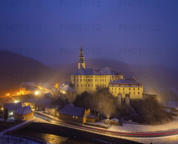Winter evening in the Müglitz valley, impressively illuminated Weesenstein Castle at the blue hour,