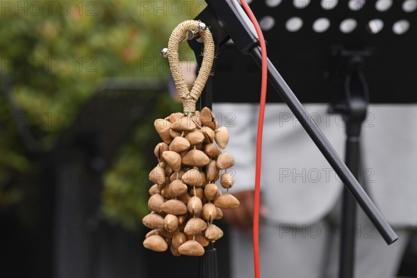 Kenari shaker, a percussion music instrument made from Kenari seed nutshells attached to a wrist