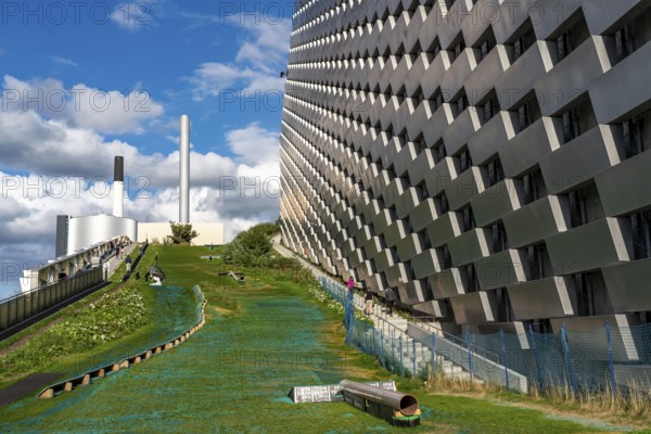 CopenHill, waste incineration plant and artificial ski slope, skiing with a view of the ski lift,