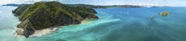 Aerial view, tropical islands and sailing boat in the turquoise ocean, Tortuga Island, Puntarenas,