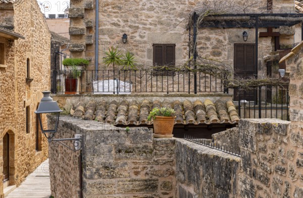 View of Mediterranean houses, roofs and courtyards from the town wall, Alcudia, Majorca, Spain,