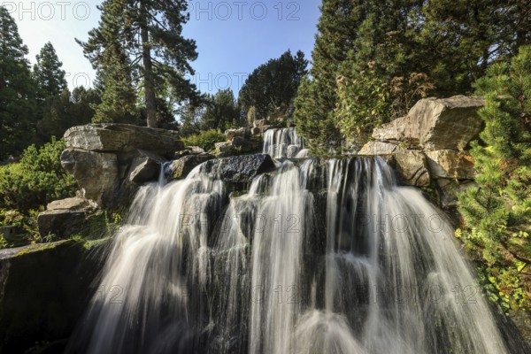Essen, North Rhine-Westphalia, Germany - Alpinum with waterfall, Grugapark, a park in Essen,