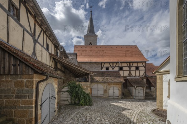 Former so-called Kirchgaden, barns in the historic fortified church, behind the tower of the church