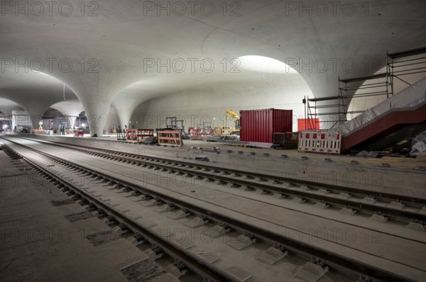 Tracks, track bed on concrete, chalice supports in the cathedral, construction site, construction