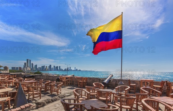 Street cafe in colonial Cartagena Walled City (Cuidad Amurrallada) overlooking scenic shoreline of