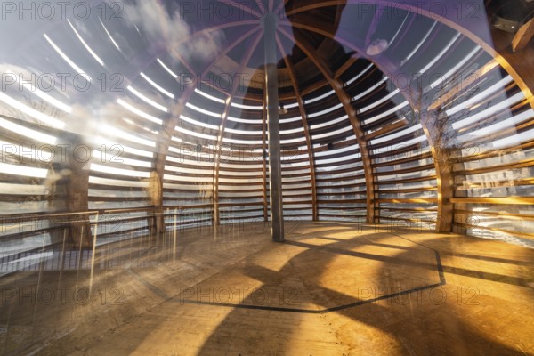 Interior view of a wooden sphere structure with incidence of light and shadow, translucent wood,