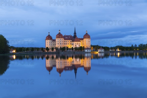 Moritzburg Hunting Lodge with reflection in the castle pond in the evening, Moritzburg, Saxony,