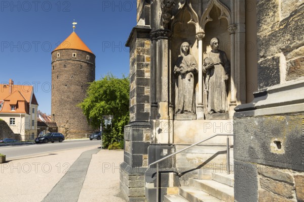 Donatsturm and entrance to the Jakobikirche with figures of Maria and Matha, Freiberg, Saxony,