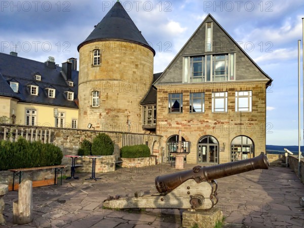 View from Altane to historical cannon in the foreground behind it on the right entrance to torture