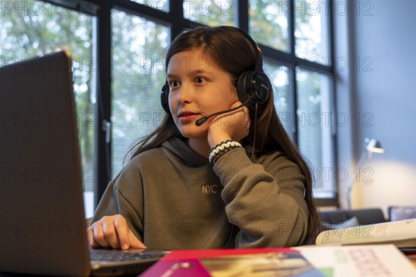 Homeschooling, girl, 11 years old, learns at home, home learning, lessons at home, distance