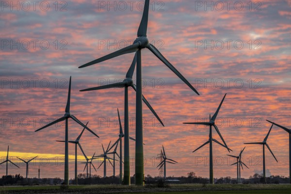 Wind farm near the East Frisian town of Norden, east of the town, sunset, Lower Saxony, Germany,