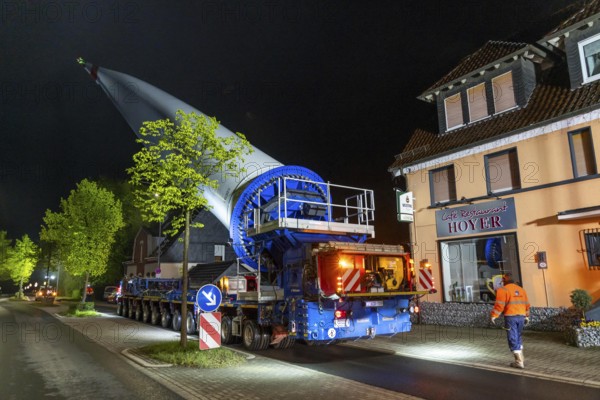 Transport of a 68 metre long, 22 tonne blade of a wind turbine, here in Breckerfeld-Waldbauer, with