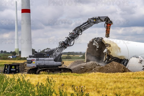 Demolished tower of a 20 year old wind turbine, in the Werl wind farm, 5 old Enercon E-66 turbines