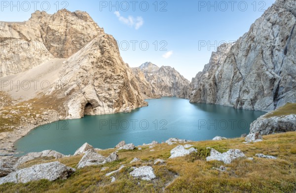 Turquoise mountain lake Kol Suu with rocky steep mountains, Kol Suu Lake, Sary Beles Mountains,