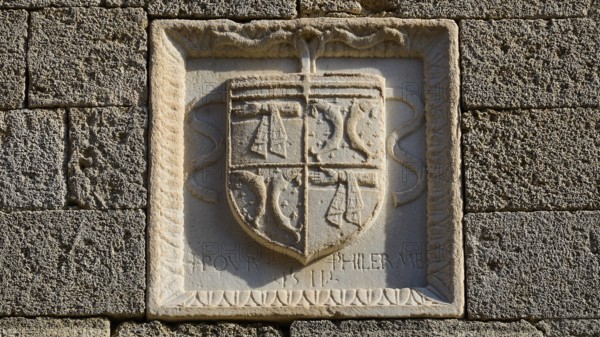 Small square stone relief with a coat of arms and a partially legible inscription, Knights' Street,