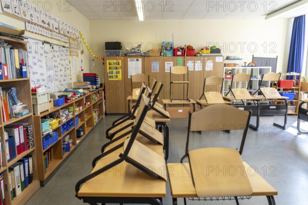 Classroom of a fourth grade, after school, the building is older but in good condition, modern