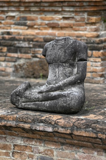 Buddha statue without head in Wat Mahathat Ayutthaya, Temple of the Great and Holy Relic,