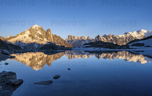 Evening mood, mountain landscape at sunset, alpenglow, water reflection in Lac Blanc, mountain