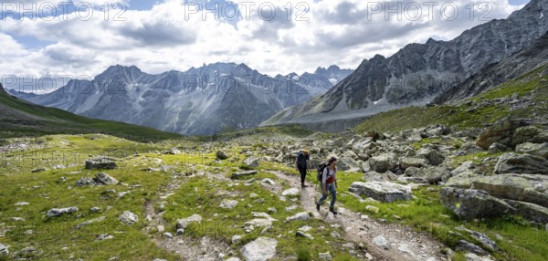 Mountaineer on a hiking trail, mountain landscape near Arolla, ascent to Col de Riedmatten, Valais,