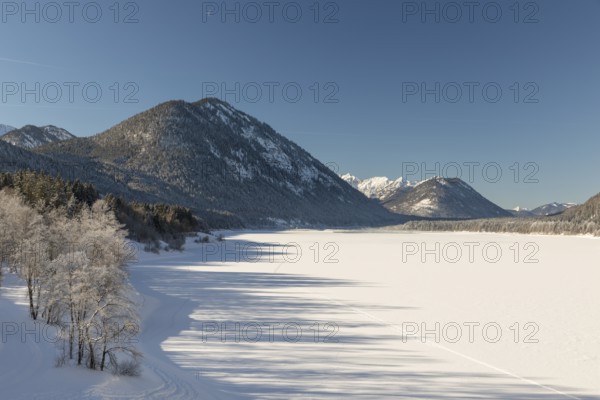 Frozen Sylvenstein reservoir, covered with snow. Isar valley in winter at temperatures of minus 18