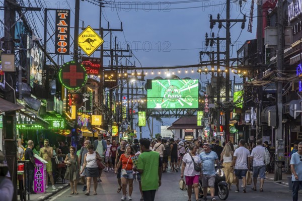 Crowds of people on Bangla Street in the evening. Nightlife on Bangla Walking Street with go-go