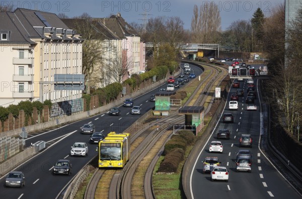 Essen, North Rhine-Westphalia, Germany - Cars and a public bus drive through Essen city centre on