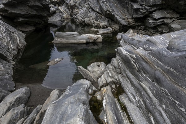 Rocks, granite rock formations in the Maggia River near Ponte Brolla, in the Maggia Valley, Valle