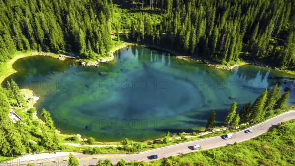Aerial view capturing the stunning turquoise waters of alpine lake karersee reflecting the