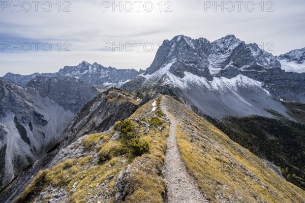 Hiking trail on the ridge of the Hahnkampl, mountain panorama with steep rocky peaks, view of