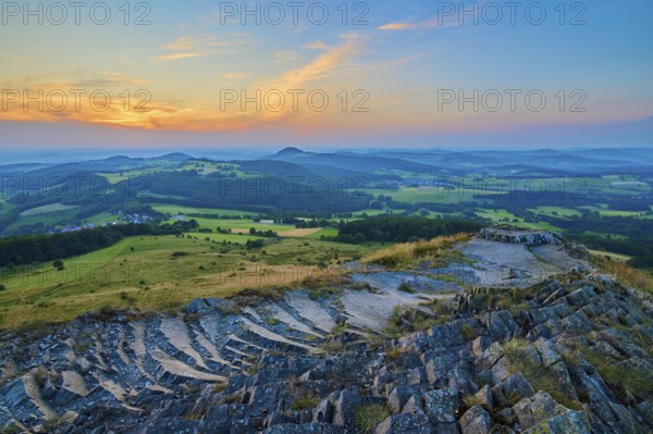 Colourful hilly landscape at sunset, showing fields and a dramatically coloured sky, Abtsroder