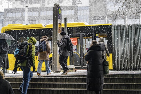 Winter weather, heavy snowfall, passengers waiting for the bus in the snow, at Essen central